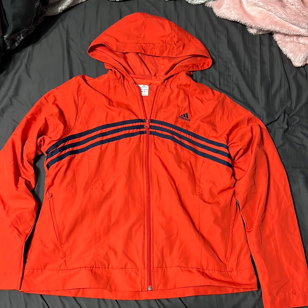 Orange w/navy blue stripes. Adidas. Jacket. Size Large.